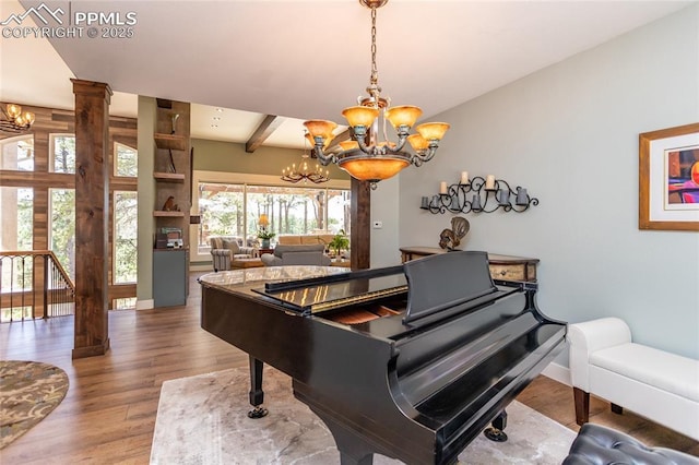 18383 Lazy Summer Way, Monument, CO 80132 - sitting room with a chandelier, wood finished floors, baseboards, and beamed ceiling