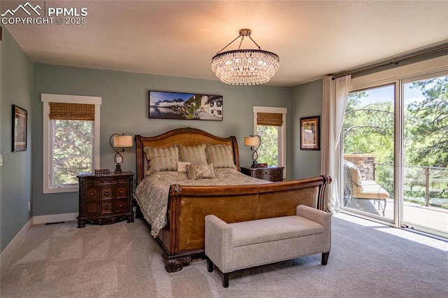 18383 Lazy Summer Way, Monument, CO 80132 - bedroom featuring carpet, access to exterior, a chandelier, and multiple windows