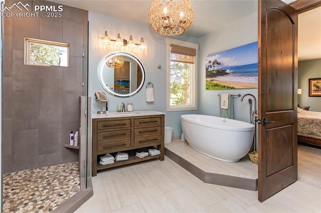 18383 Lazy Summer Way, Monument, CO 80132 - bathroom featuring a soaking tub, vanity, plenty of natural light, and a tile shower