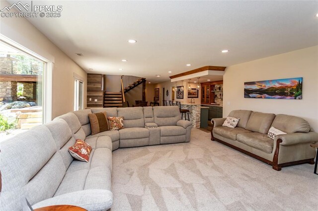 18383 Lazy Summer Way, Monument, CO 80132 - living room featuring stairway, recessed lighting, light carpet, and bar