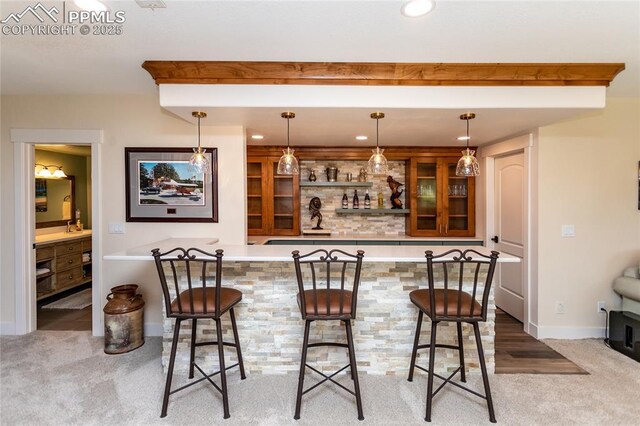 18383 Lazy Summer Way, Monument, CO 80132 - indoor bar with carpet flooring, recessed lighting, baseboards, and decorative light fixtures