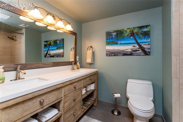 18383 Lazy Summer Way, Monument, CO 80132 - bathroom featuring double vanity, toilet, baseboards, a shower, and tile patterned flooring