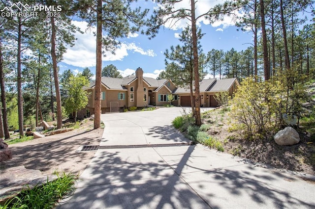 18383 Lazy Summer Way, Monument, CO 80132 - ranch-style house featuring concrete driveway and stucco siding