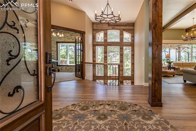 18383 Lazy Summer Way, Monument, CO 80132 - foyer entrance featuring a chandelier, hardwood / wood-style flooring, and healthy amount of natural light