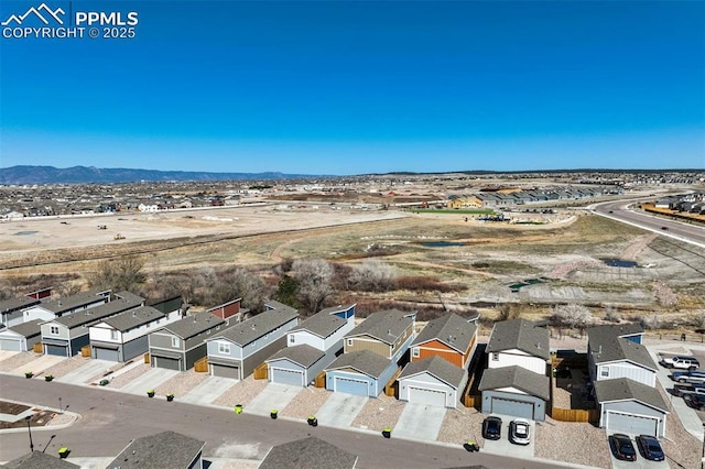 bird's eye view featuring a mountain view and a residential view