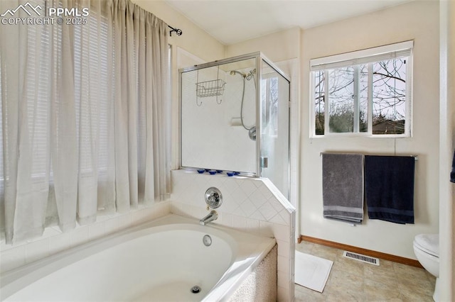 6627 Wagon Ridge Dr, Colorado Springs, CO 80923 - bathroom with visible vents, baseboards, toilet, an enclosed shower, and a garden tub