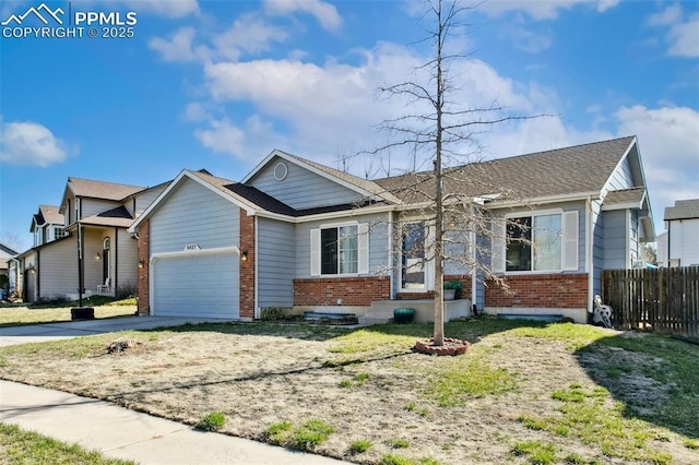 6627 Wagon Ridge Dr, Colorado Springs, CO 80923 - ranch-style home featuring an attached garage, driveway, fence, and brick siding