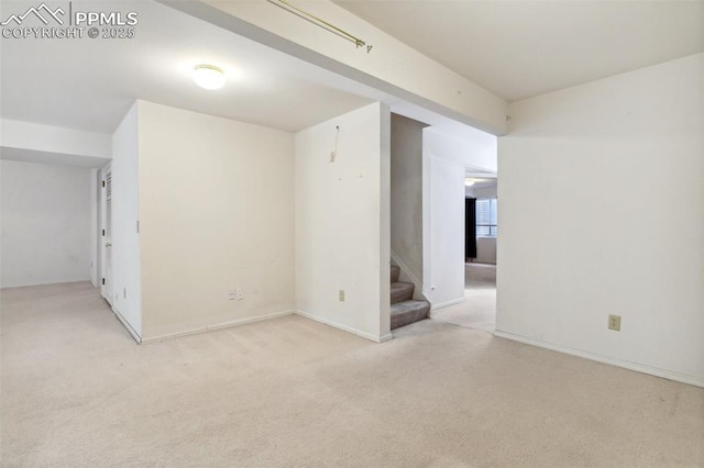 6627 Wagon Ridge Dr, Colorado Springs, CO 80923 - spare room featuring light carpet and stairway