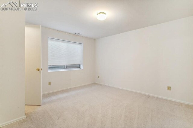 6627 Wagon Ridge Dr, Colorado Springs, CO 80923 - carpeted empty room with baseboards