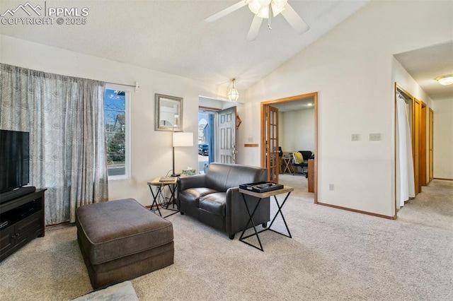 6627 Wagon Ridge Dr, Colorado Springs, CO 80923 - carpeted living area featuring high vaulted ceiling, french doors, baseboards, and ceiling fan