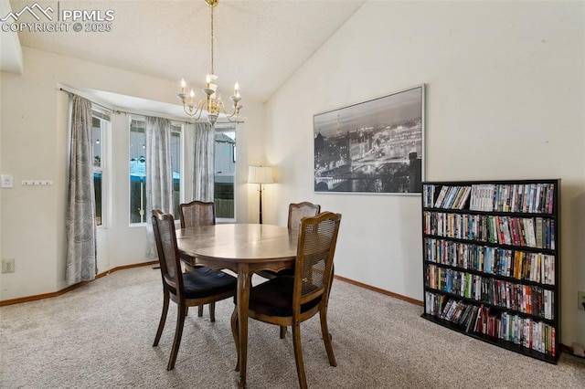 6627 Wagon Ridge Dr, Colorado Springs, CO 80923 - dining area featuring an inviting chandelier, baseboards, vaulted ceiling, and carpet floors