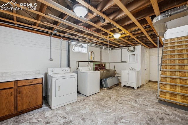 below grade area featuring washer and clothes dryer and stairs