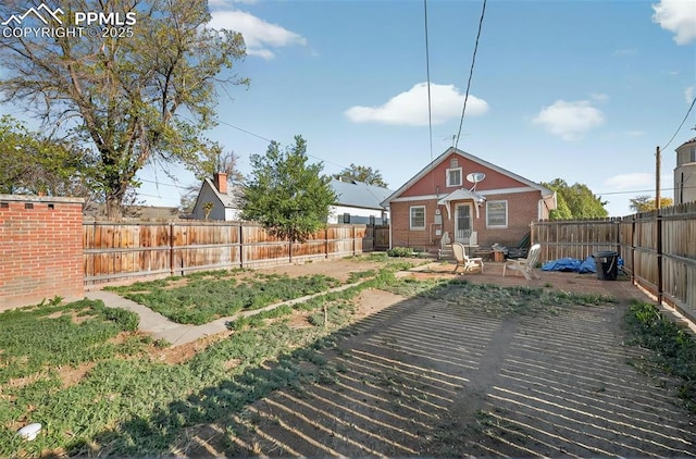 view of yard with a fenced backyard