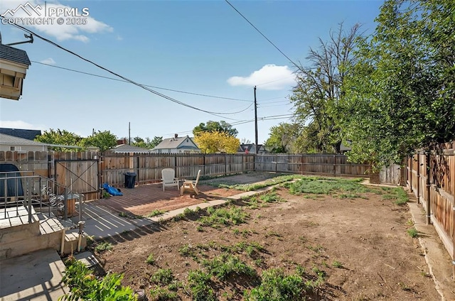 view of yard featuring a wooden deck and a fenced backyard