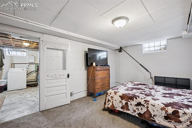 bedroom with carpet flooring, a paneled ceiling, washer / clothes dryer, and multiple windows