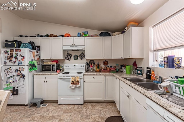 735 E Vermijo Ave, Colorado Springs, CO 80903 - kitchen with a sink, lofted ceiling, white appliances, light countertops, and under cabinet range hood