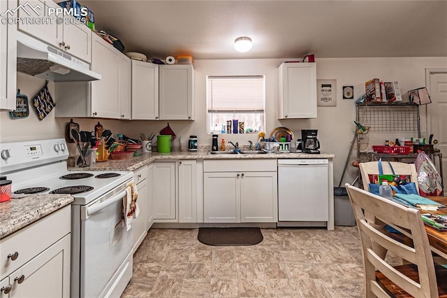 735 E Vermijo Ave, Colorado Springs, CO 80903 - kitchen featuring under cabinet range hood, a sink, white appliances, light stone countertops, and white cabinetry