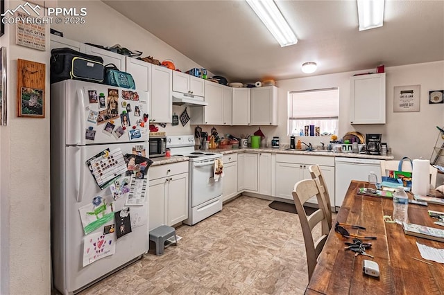 735 E Vermijo Ave, Colorado Springs, CO 80903 - kitchen with white cabinets, under cabinet range hood, light floors, a sink, and white appliances