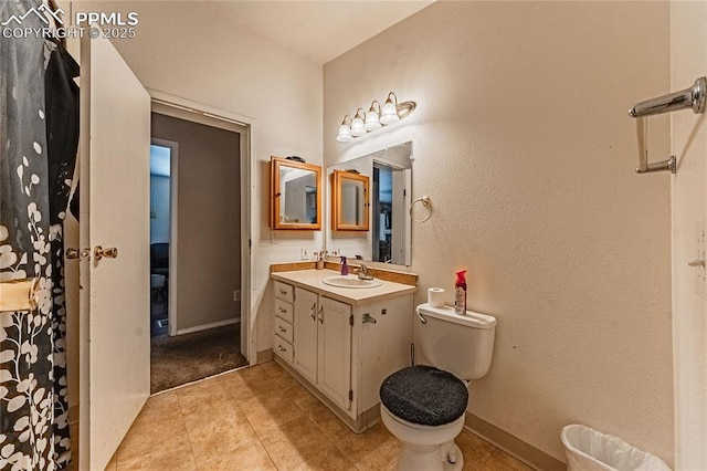 735 E Vermijo Ave, Colorado Springs, CO 80903 - full bathroom with vanity, tile patterned flooring, and toilet