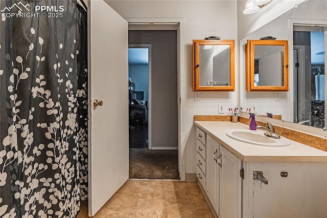 735 E Vermijo Ave, Colorado Springs, CO 80903 - bathroom featuring tile patterned floors and vanity