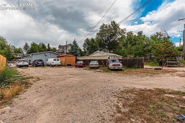 735 E Vermijo Ave, Colorado Springs, CO 80903 - view of front of property with fence and driveway