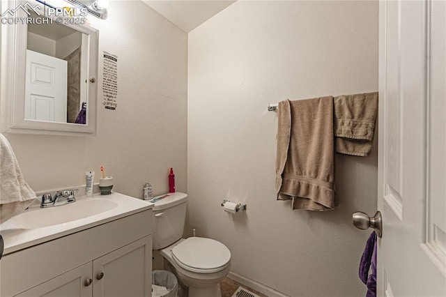 735 E Vermijo Ave, Colorado Springs, CO 80903 - bathroom featuring baseboards, toilet, and vanity