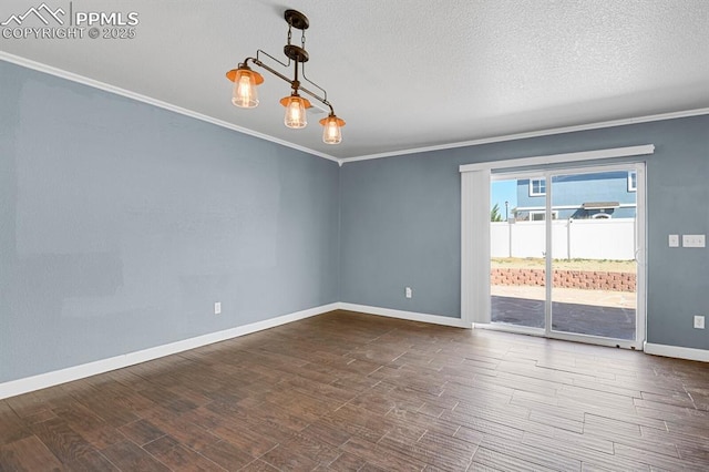 empty room with baseboards, dark wood-type flooring, and ornamental molding