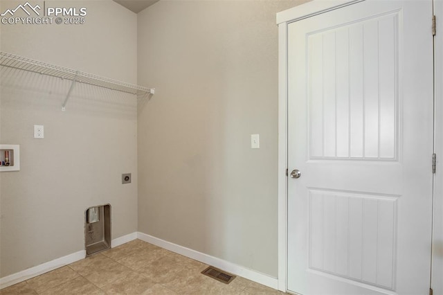 clothes washing area with visible vents, baseboards, washer hookup, laundry area, and electric dryer hookup