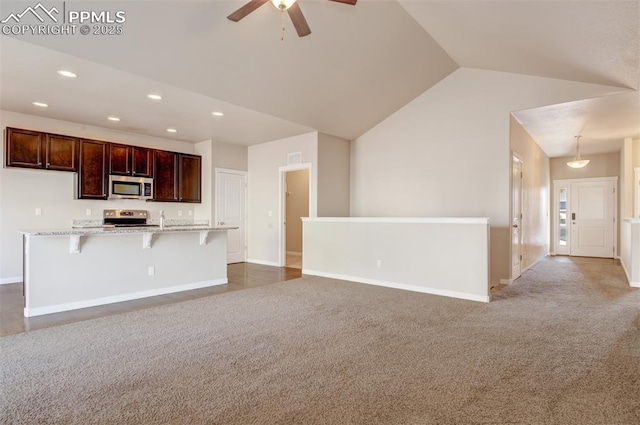 unfurnished living room with baseboards, recessed lighting, a ceiling fan, lofted ceiling, and carpet