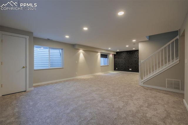basement with visible vents, recessed lighting, carpet, and stairs