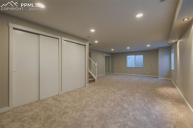 basement with recessed lighting, carpet, stairs, and baseboards