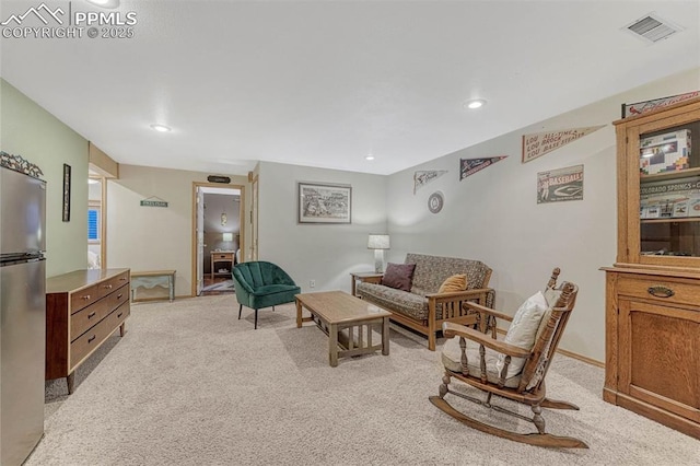 living area with light colored carpet, baseboards, visible vents, and recessed lighting
