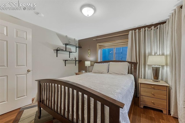 bedroom featuring wood finished floors