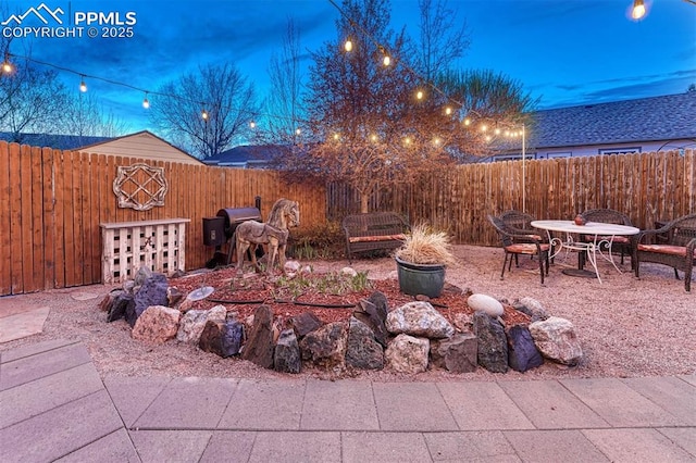 view of yard featuring a patio and a fenced backyard