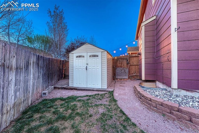 view of shed featuring a fenced backyard