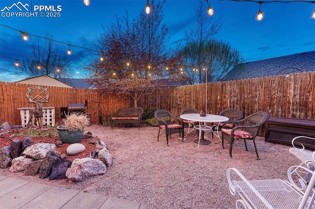 view of patio with a fenced backyard and outdoor dining space