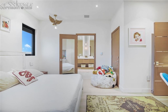 bedroom with baseboards, ensuite bathroom, visible vents, and recessed lighting