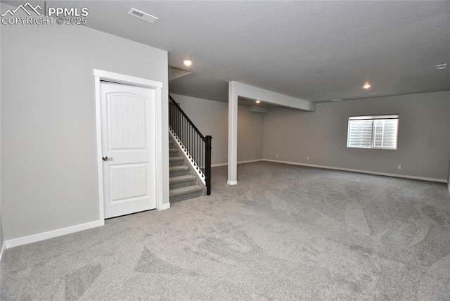 basement featuring baseboards, stairway, carpet, and recessed lighting