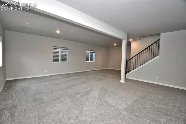 below grade area with stairway, recessed lighting, carpet flooring, and baseboards
