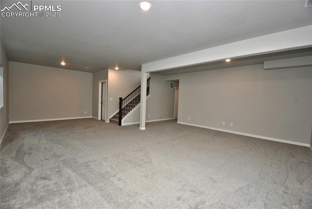 finished basement with recessed lighting, stairs, baseboards, and carpet floors