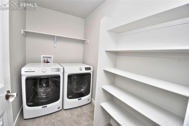 washroom with independent washer and dryer, laundry area, and baseboards