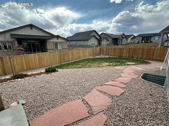 view of yard with a residential view and fence private yard