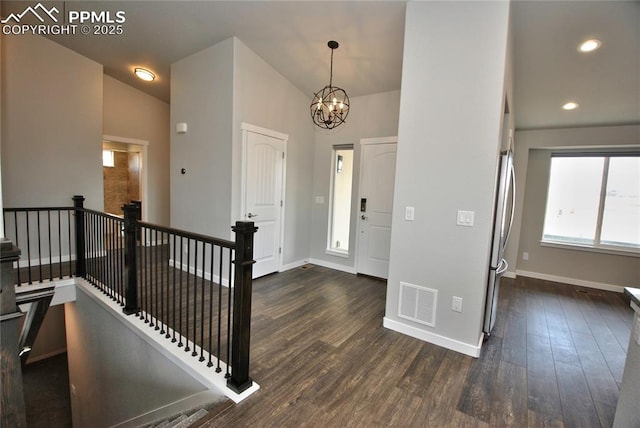 entryway featuring visible vents, baseboards, an inviting chandelier, recessed lighting, and dark wood-type flooring