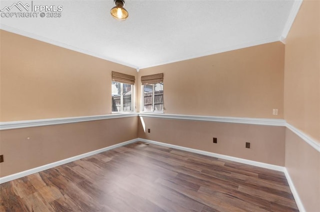 3828 Breaking Dawn St, Colorado Springs, CO 80925 - unfurnished room featuring baseboards, crown molding, and wood finished floors