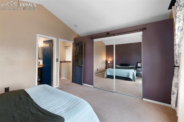 3828 Breaking Dawn St, Colorado Springs, CO 80925 - carpeted bedroom featuring a closet, baseboards, and lofted ceiling