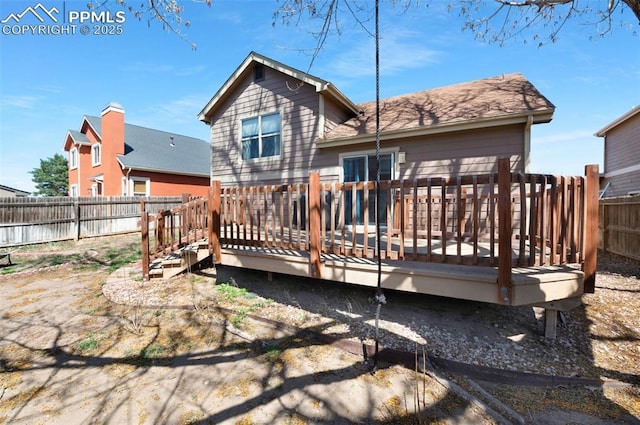 3828 Breaking Dawn St, Colorado Springs, CO 80925 - back of property featuring a fenced backyard and a wooden deck