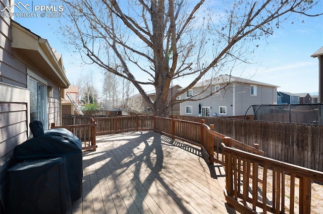 3828 Breaking Dawn St, Colorado Springs, CO 80925 - wooden deck with a fenced backyard, a residential view, and grilling area