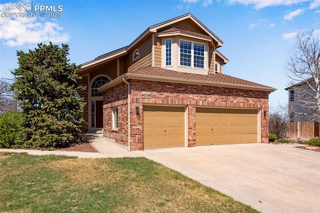 view of front of property with driveway, a garage, fence, and brick siding