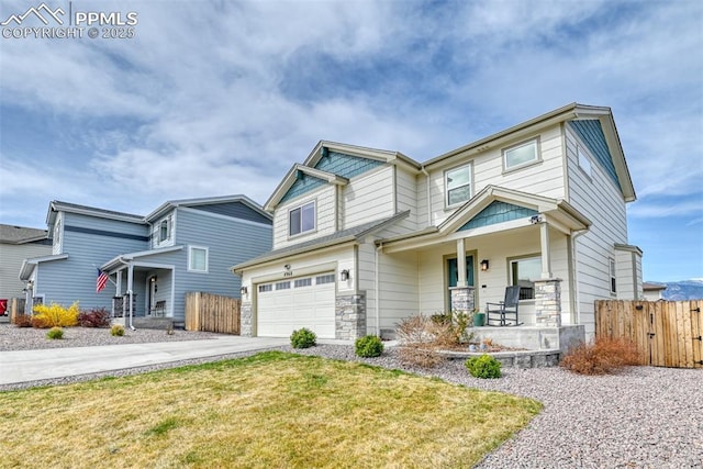 craftsman house with concrete driveway, fence, an attached garage, and covered porch