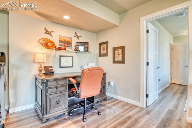 office space featuring recessed lighting, light wood finished floors, and baseboards